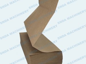 The kraft paper roll get perforated cutting and folding by our machine automatically and stack to a pile to be collected.