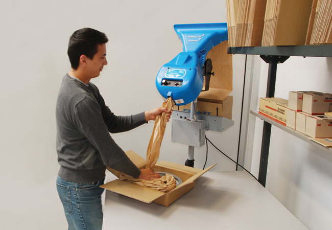 How does a fanfold kraft paper folding machine work